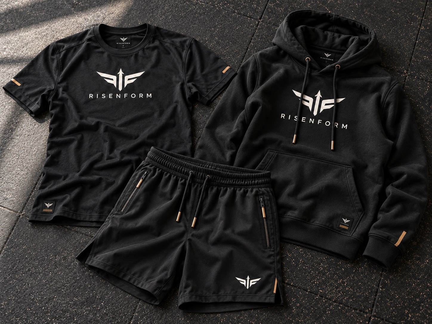 Risenform concept black training tee, hoodie and shorts with off-white emblems and bronze details